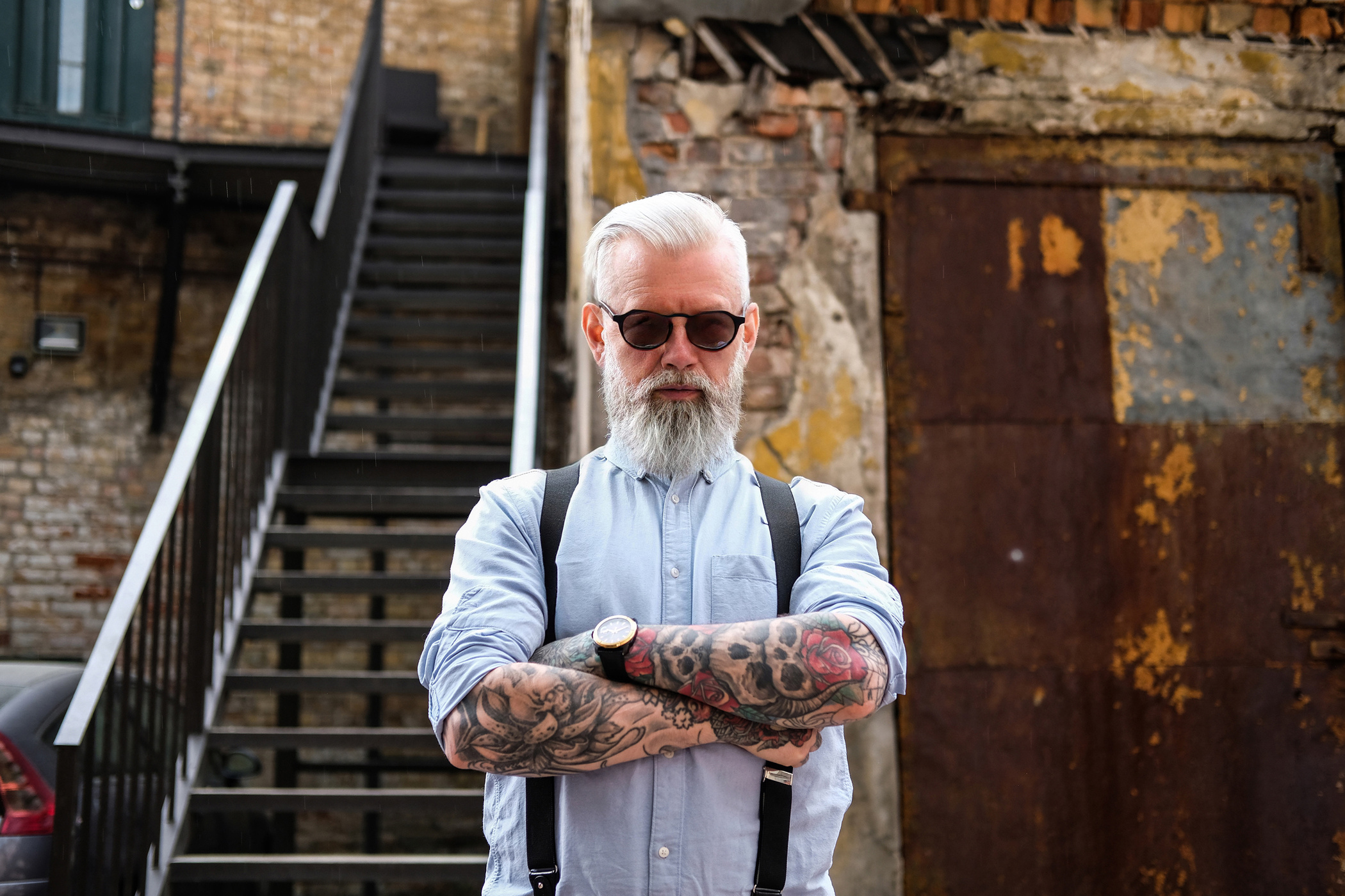 Elegant Old Man Dressed in Shirt and Pants with Suspenders Outdoors